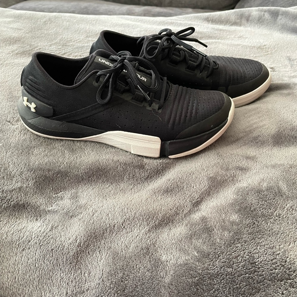 Women’s black and white UA Tribase training shoe.